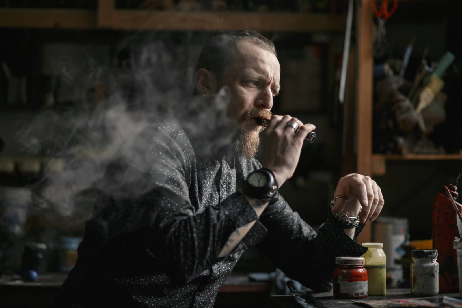 Man Portrait Smoking An Electronic Cigarette In Art Studio